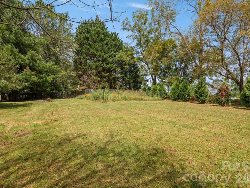 50 Long Cove Road, Candler, NC 28715.  MLS# CAR4430408, YatesRealty ID 54113. Upper backyard
