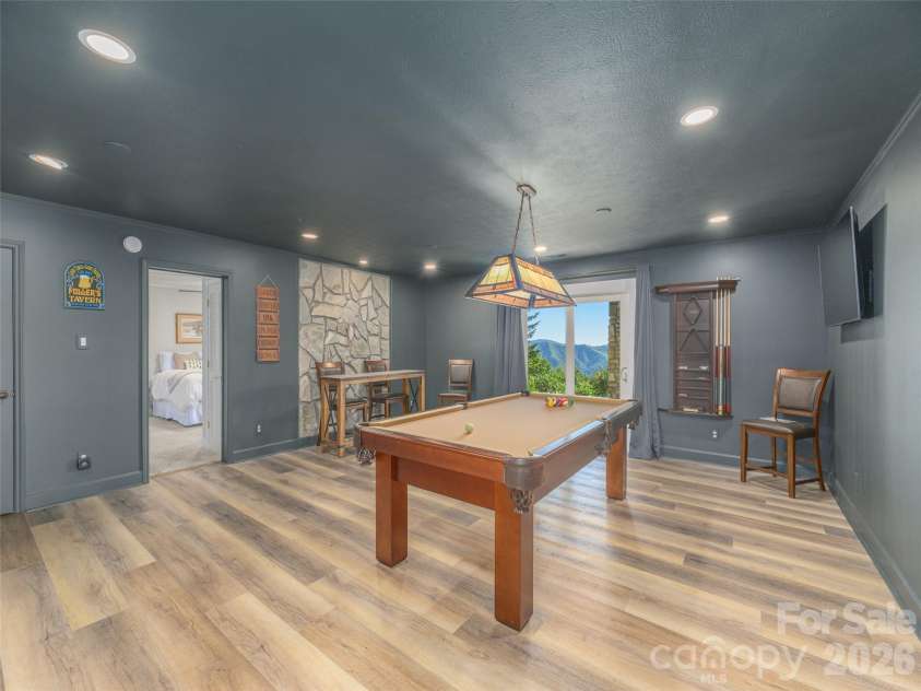 465 Leatherwood Road, Maggie Valley, NC 28751.  MLS# CAR4430446, YatesRealty ID 54136. Large den/gameroom