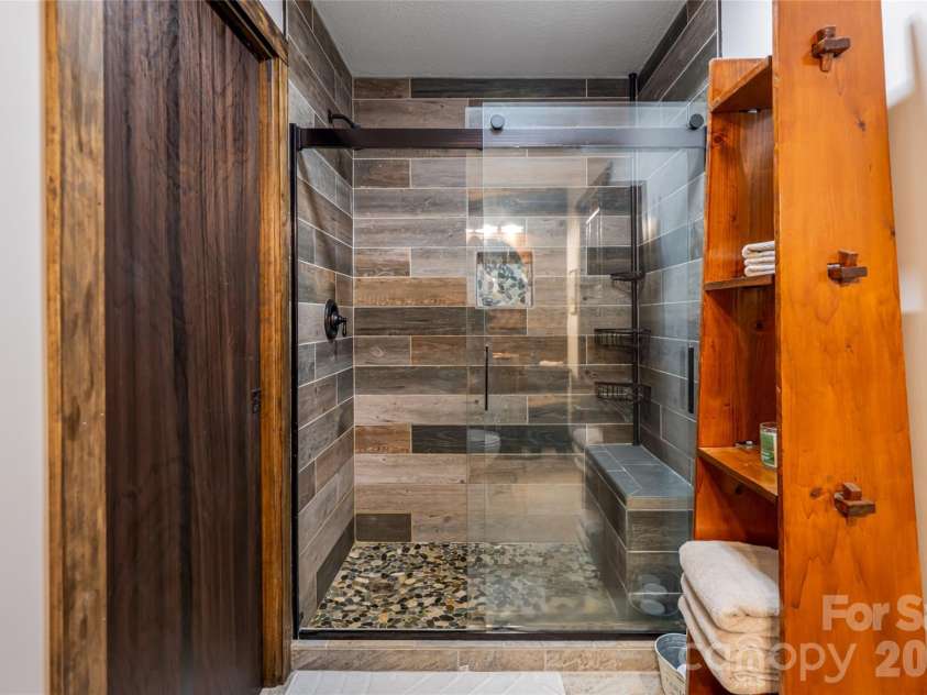 19 Forge Drive, Mills River, NC 28759.  MLS# CAR4429305, YatesRealty ID 54159. Tiled, Walk-In Shower with Sitting Bench