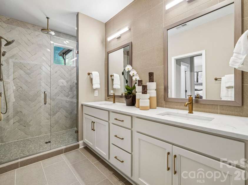 25029 Sprenger Drive, Cornelius, NC 28031.  MLS# CAR4430610, YatesRealty ID 54200. Sample Photo Only - Model Home - Interior Unit Shown - Primary Bathroom