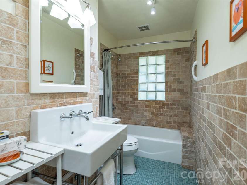 710 Merrimon Avenue, Asheville, NC 28804.  MLS# CAR4430007, YatesRealty ID 54201. Updated Bathroom upstairs