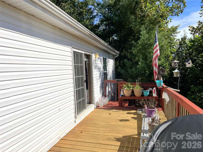 121 Hidden Meadow Drive, Candler, NC 28715.  MLS# CAR4430156, YatesRealty ID 54224. Sliding doors and deck