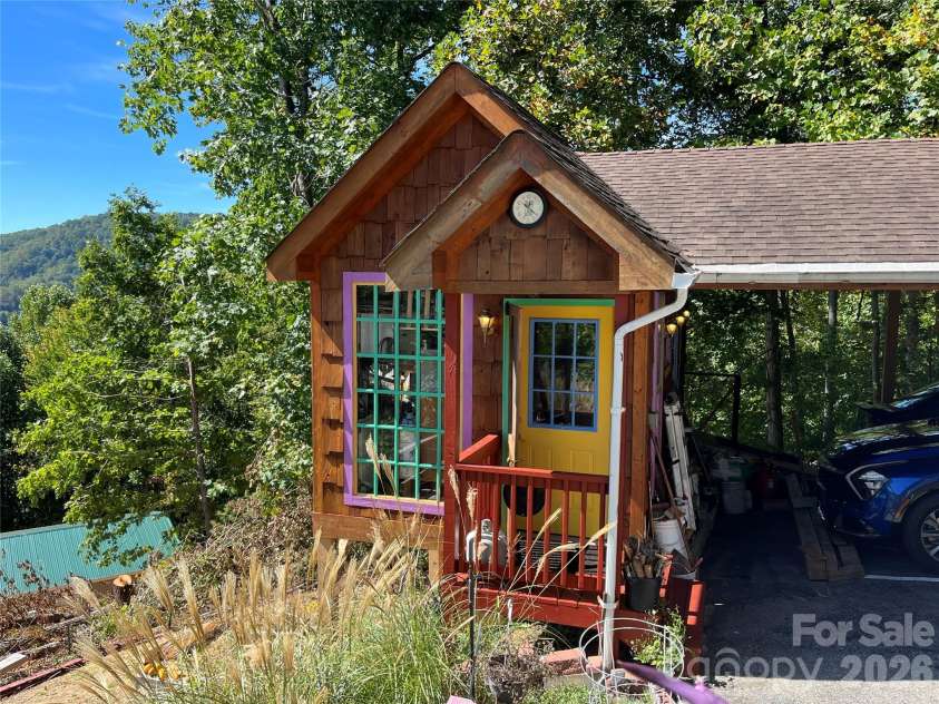 121 Hidden Meadow Drive, Candler, NC 28715.  MLS# CAR4430156, YatesRealty ID 54224. Workshop front door