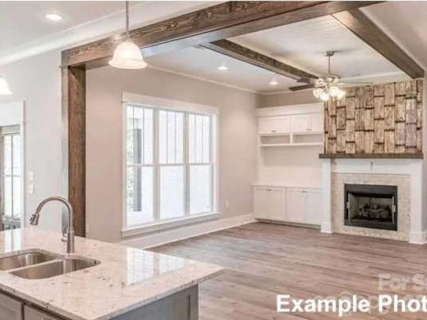 194 Sams Way, Statesville, NC 28625.  MLS# CAR4428928, YatesRealty ID 54228. Craftsman House Plan #50-249 - Great Room With Optional Fireplace