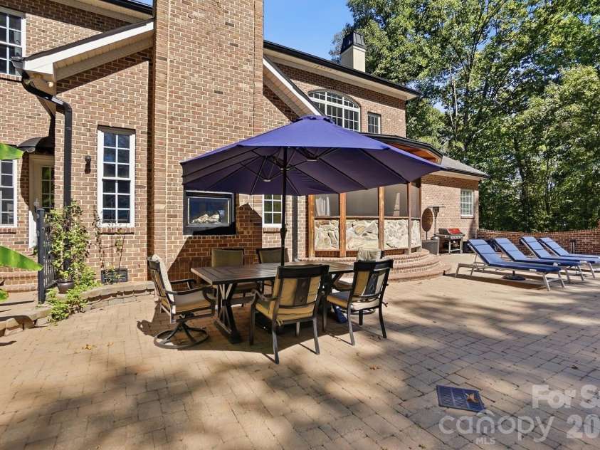 2930 Sweetgrass Lane, Monroe, NC 28112.  MLS# CAR4418923, YatesRealty ID 54232. Extended Custom patio with 2 way Fireplace