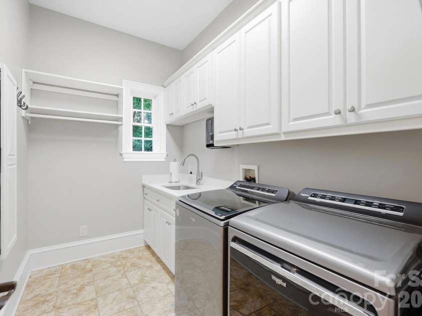 2930 Sweetgrass Lane, Monroe, NC 28112.  MLS# CAR4418923, YatesRealty ID 54232. Large Laundry Room