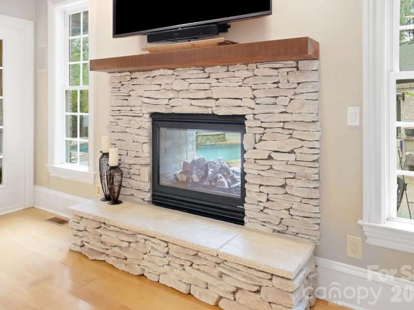 2930 Sweetgrass Lane, Monroe, NC 28112.  MLS# CAR4418923, YatesRealty ID 54232. Living Room/Den with 2 way Fireplace