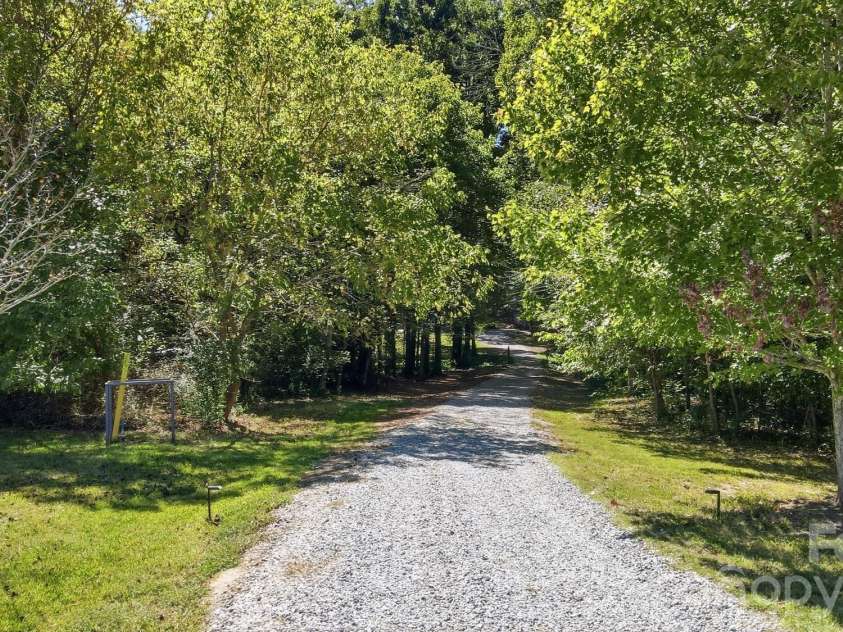 2930 Sweetgrass Lane, Monroe, NC 28112.  MLS# CAR4418923, YatesRealty ID 54232. Long Private Driveway