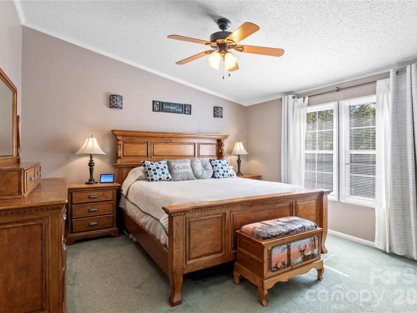 183 Gobbler Circle, Horse Shoe, NC 28742.  MLS# CAR4430660, YatesRealty ID 54240. Primary bedroom, separated from the additional bedrooms by the split-bedroom layout.