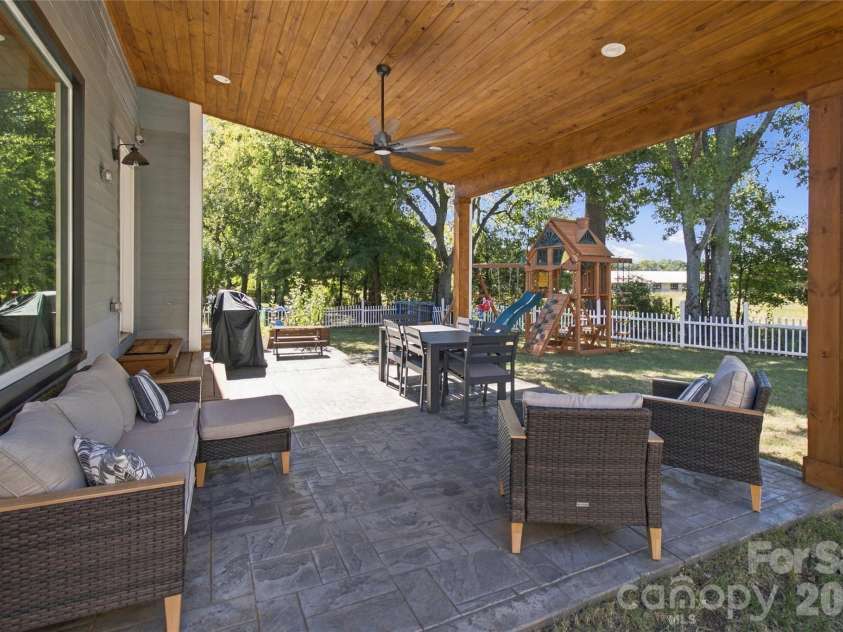 613 Weyburn Drive, Concord, NC 28027.  MLS# CAR4429477, YatesRealty ID 54278. Back patio