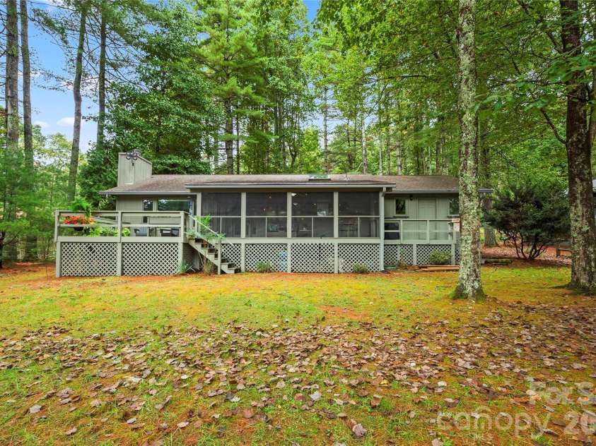 109 Middle Connestee Trail, Brevard, NC 28712.  MLS# CAR4429335, YatesRealty ID 54285. Easy access to the level backyard