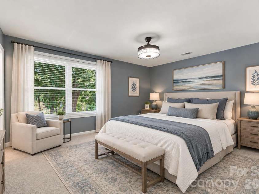 9071 Tulagi Court, Tega Cay, SC 29708.  MLS# CAR4429137, YatesRealty ID 54288. Virtually staged main floor primary bed/ bath - new carpet