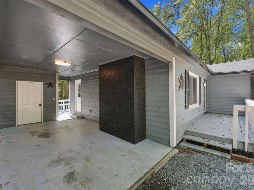 2909 Matoka Trail, Matthews, NC 28104.  MLS# CAR4426657, YatesRealty ID 54325. Car port with locked storage space
