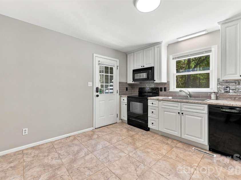 2909 Matoka Trail, Matthews, NC 28104.  MLS# CAR4426657, YatesRealty ID 54325. Kitchen with back door entrance