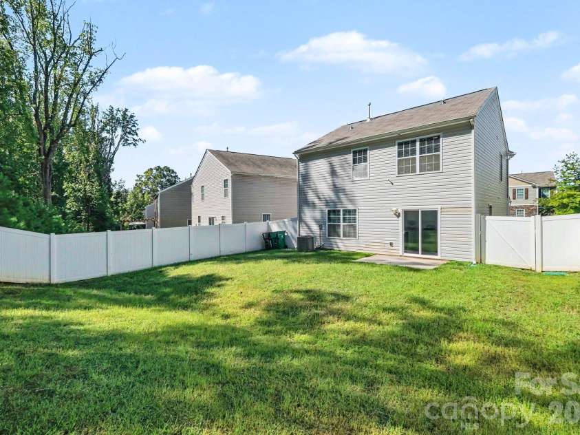 6826 Broad Valley Court, Charlotte, NC 28216.  MLS# CAR4426143, YatesRealty ID 54333. Fenced back yard