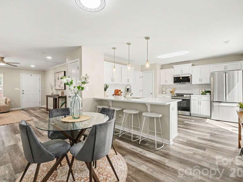 6826 Broad Valley Court, Charlotte, NC 28216.  MLS# CAR4426143, YatesRealty ID 54333. Kitchen and Dining