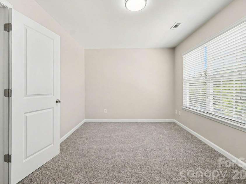 6826 Broad Valley Court, Charlotte, NC 28216.  MLS# CAR4426143, YatesRealty ID 54333. Secondary bedroom