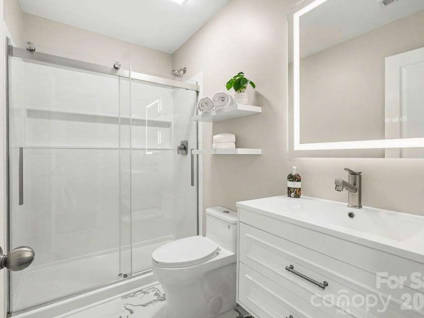 6826 Broad Valley Court, Charlotte, NC 28216.  MLS# CAR4426143, YatesRealty ID 54333. Updated guest bath