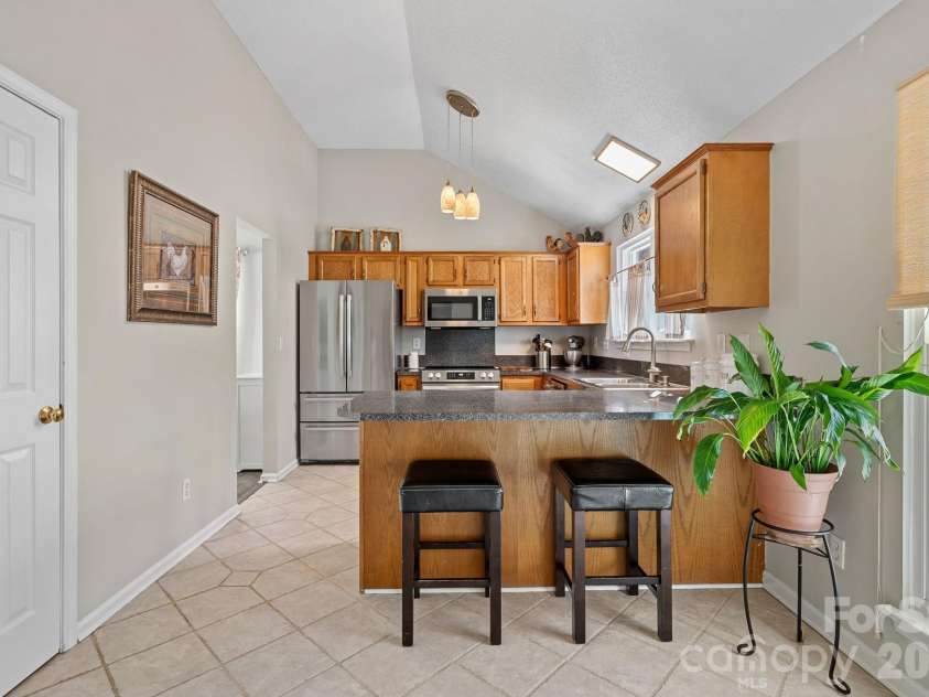 628 Rebecca Jane Drive, Mooresville, NC 28115.  MLS# CAR4425615, YatesRealty ID 54335. Kitchen with breakfast bar
