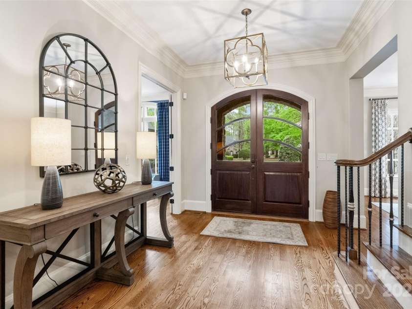 9011 Pine Laurel Drive, Weddington, NC 28104.  MLS# CAR4241805, YatesRealty ID 5434. Arched Wood and Glass Double Front Door