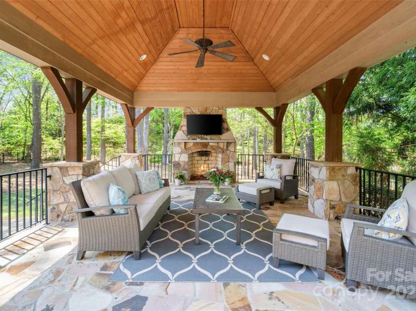 9011 Pine Laurel Drive, Weddington, NC 28104.  MLS# CAR4241805, YatesRealty ID 5434. Covered Veranda with Fireplace