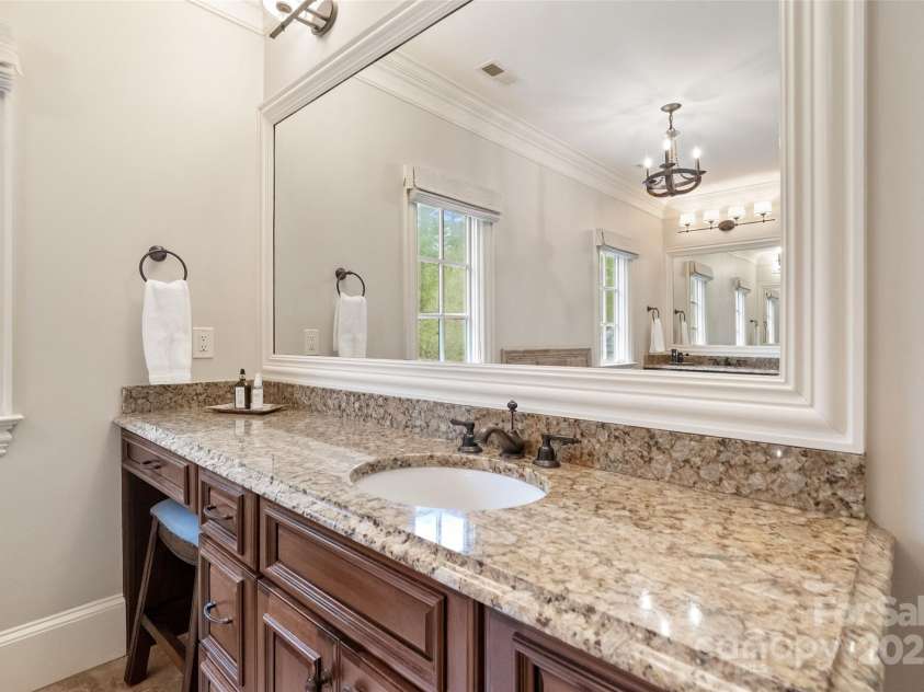 9011 Pine Laurel Drive, Weddington, NC 28104.  MLS# CAR4241805, YatesRealty ID 5434. Large mirror, granite counter tops, windows for natural light