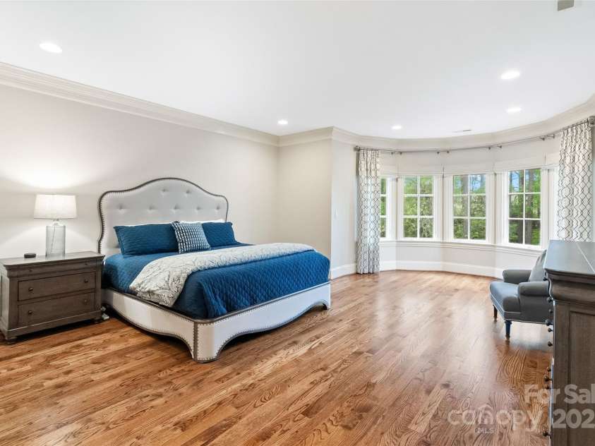 9011 Pine Laurel Drive, Weddington, NC 28104.  MLS# CAR4241805, YatesRealty ID 5434. Primary Bedroom with sitting area and bay windows