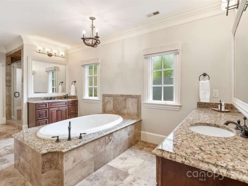 9011 Pine Laurel Drive, Weddington, NC 28104.  MLS# CAR4241805, YatesRealty ID 5434. Spa Like Bathroom with his / her vanities, soaking tub