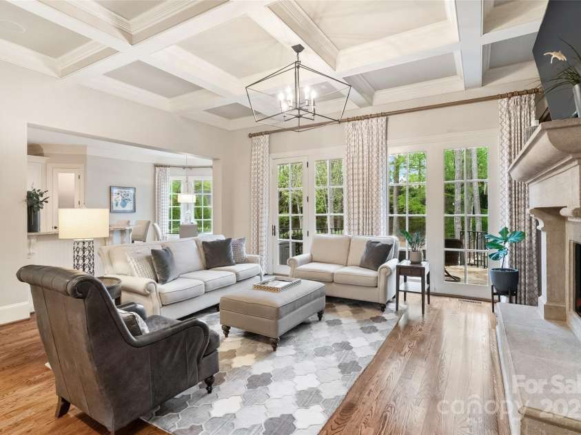 9011 Pine Laurel Drive, Weddington, NC 28104.  MLS# CAR4241805, YatesRealty ID 5434. Wall of windows with endless natural light and view of private backyard