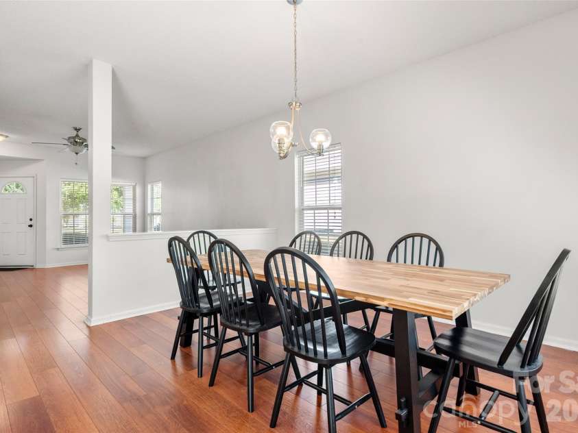 2738 Mill Valley Court, Matthews, NC 28105.  MLS# CAR4424420, YatesRealty ID 54340. Light-filled dining space highlighting the architectural half-wall that maintains an open and connected feel throughout.