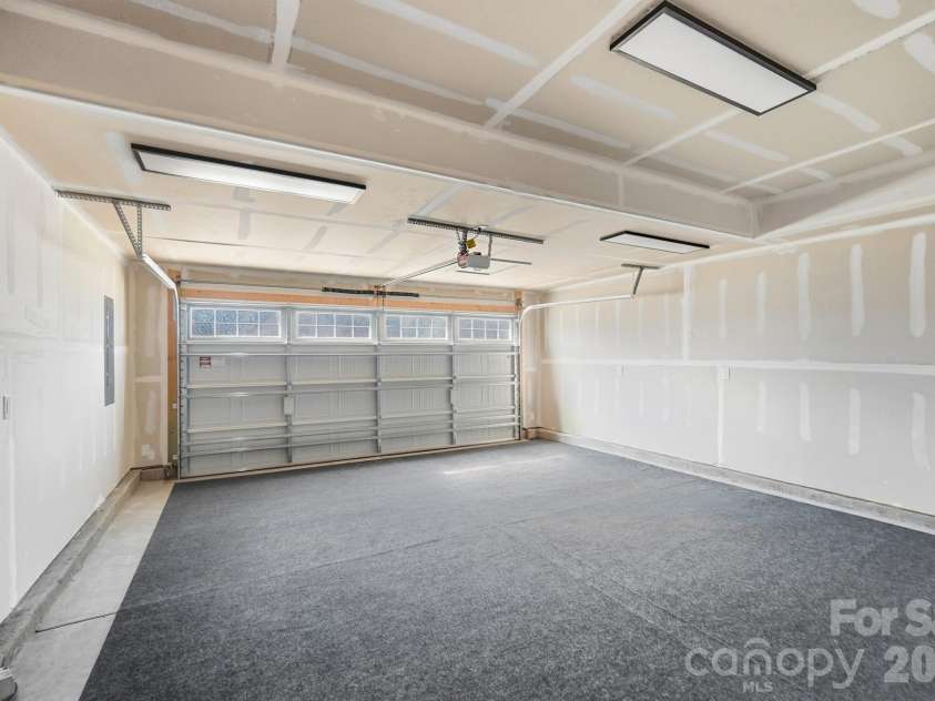 1857 Giana Lane, Monroe, NC 28112.  MLS# CAR4422864, YatesRealty ID 54344. 2 car Garage with garage carpet
