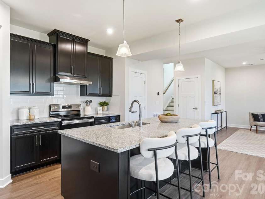 1857 Giana Lane, Monroe, NC 28112.  MLS# CAR4422864, YatesRealty ID 54344. Large Kitchen Island with built in sink