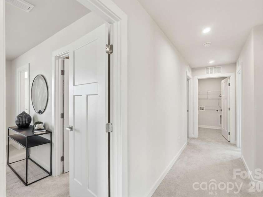 1857 Giana Lane, Monroe, NC 28112.  MLS# CAR4422864, YatesRealty ID 54344. Second-floor hallway entrance and walkway view.