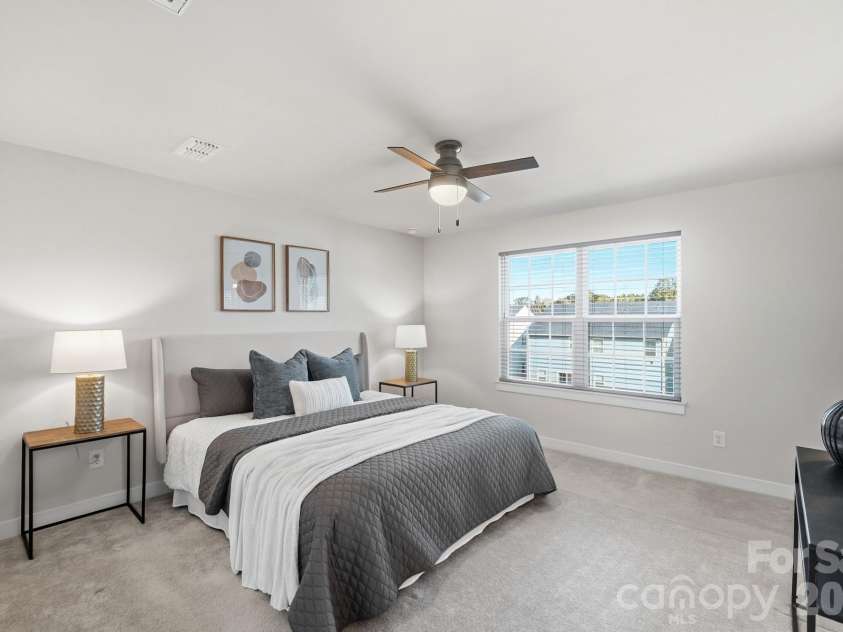 1857 Giana Lane, Monroe, NC 28112.  MLS# CAR4422864, YatesRealty ID 54344. Spacious primary bedroom with ample natural light.