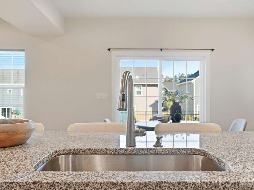 1857 Giana Lane, Monroe, NC 28112.  MLS# CAR4422864, YatesRealty ID 54344. View to back patio from kitchen