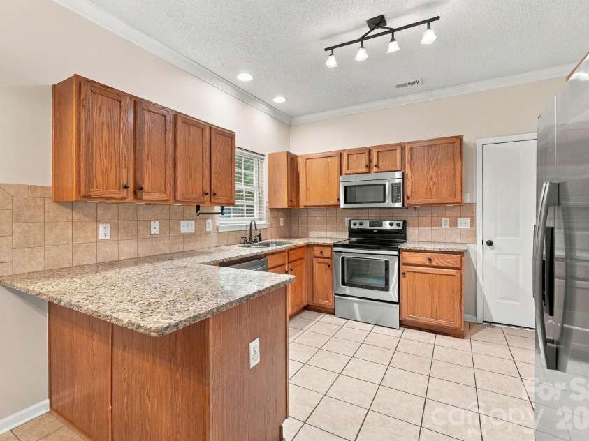 12806 English Walnut Lane, Charlotte, NC 28215.  MLS# CAR4420536, YatesRealty ID 54347. 