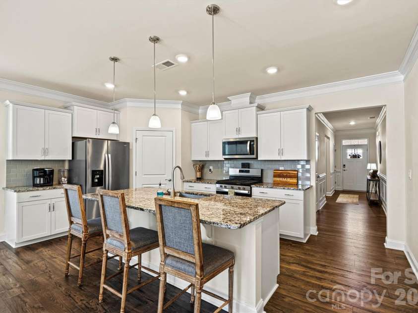 4222 Millstream Road, Denver, NC 28037.  MLS# CAR4341138, YatesRealty ID 5435. Kitchen features a gas range, granite countertops, SS appliances
