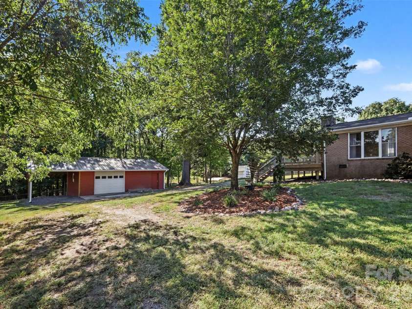 1555 Hess Road, Concord, NC 28025.  MLS# CAR4409569, YatesRealty ID 54352. Backyard View - Fully fenced yard.