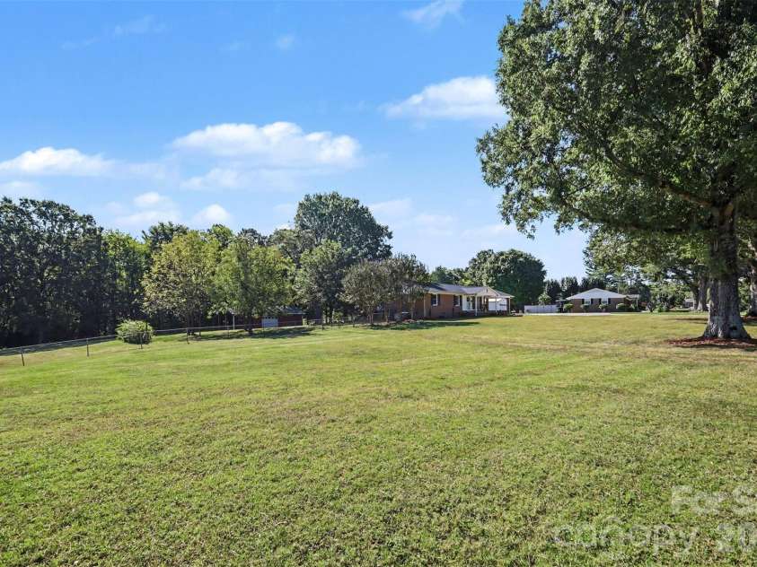 1555 Hess Road, Concord, NC 28025.  MLS# CAR4409569, YatesRealty ID 54352. Front Yard