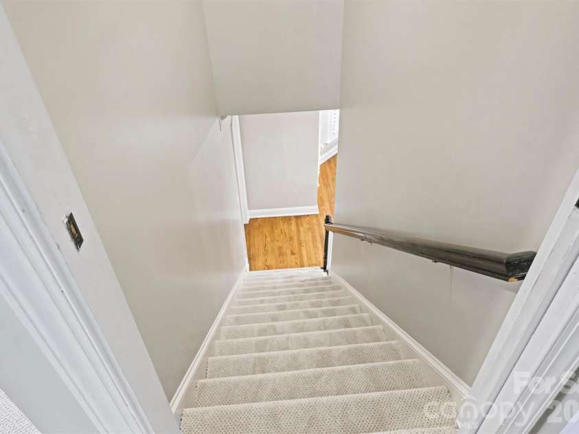 12727 Duncourtney Lane, Charlotte, NC 28277.  MLS# CAR4427559, YatesRealty ID 54365. Back staircase