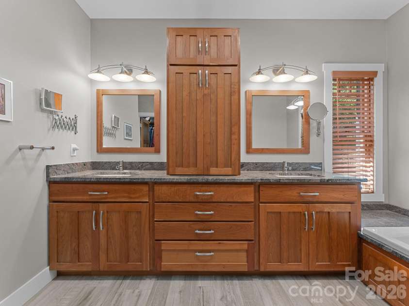 359 New Castle Road, Brevard, NC 28712.  MLS# CAR4427485, YatesRealty ID 54367. Primary bath with ample cabinetry for storage