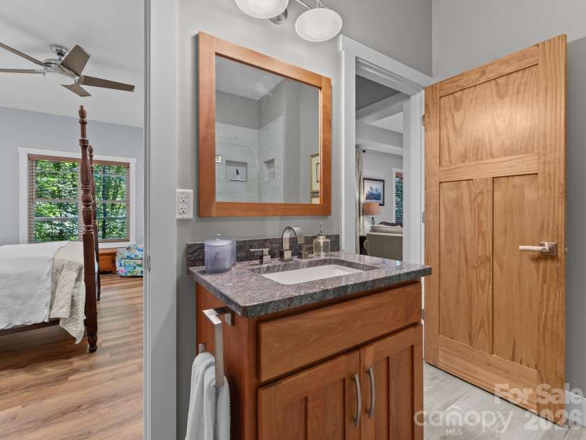 359 New Castle Road, Brevard, NC 28712.  MLS# CAR4427485, YatesRealty ID 54367. This bath also has access to the downstairs sitting area