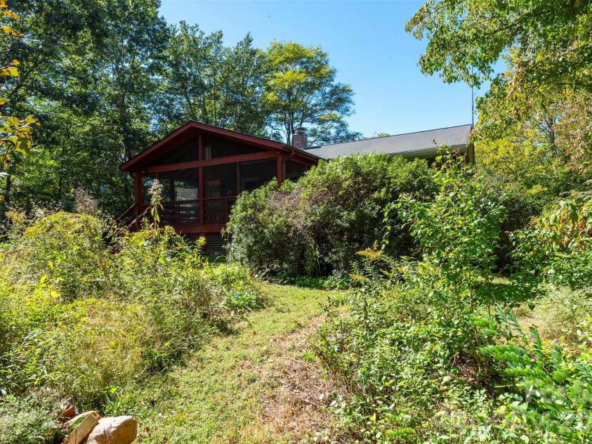 824 Cherokee Avenue, Black Mountain, NC 28711.  MLS# CAR4430479, YatesRealty ID 54382. Former microgreens garden - now a polinator field