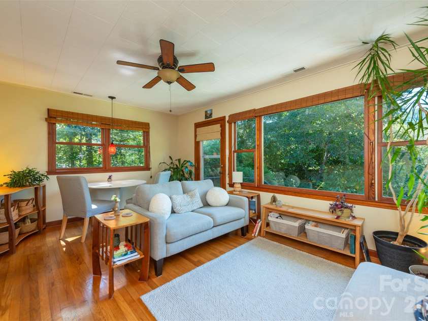 824 Cherokee Avenue, Black Mountain, NC 28711.  MLS# CAR4430479, YatesRealty ID 54382. Light filled living room and dining area