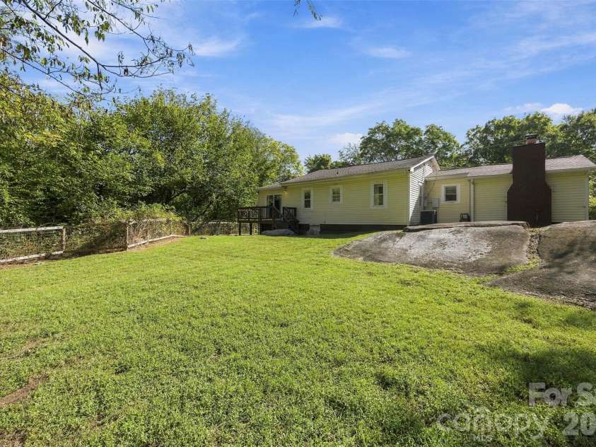 119 Walton Street, Granite Quarry, NC 28072.  MLS# CAR4425481, YatesRealty ID 54394. Large rocks for a great feature in the backyard