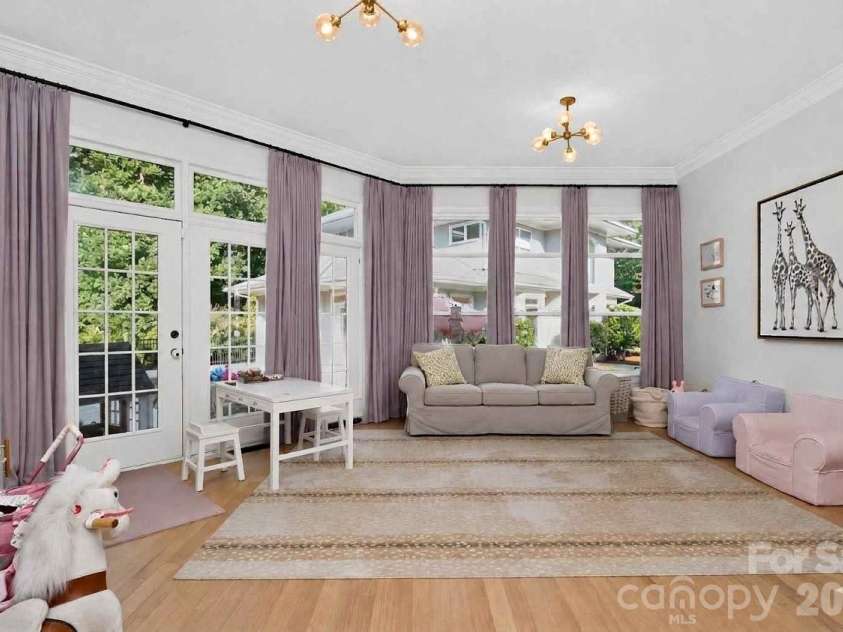1901 Cortelyou Road, Charlotte, NC 28211.  MLS# CAR4421734, YatesRealty ID 54400. Downstairs sunroom off kitchen
