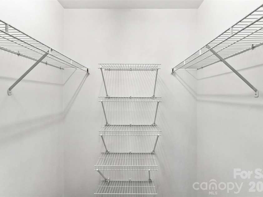 762 Marsh Road, Charlotte, NC 28209.  MLS# CAR4340120, YatesRealty ID 54407. Generously sized walk-in closet with built-in shelving