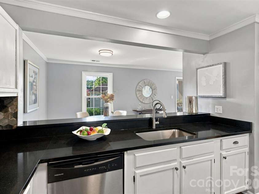 762 Marsh Road, Charlotte, NC 28209.  MLS# CAR4340120, YatesRealty ID 54407. Kitchen sink overlooks the dining area through the open breakfast bar