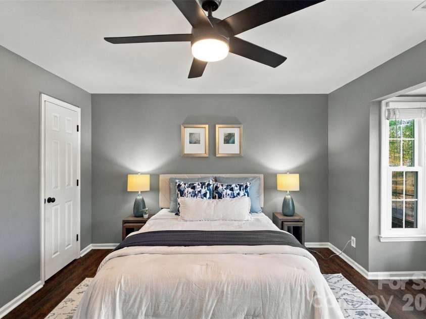 762 Marsh Road, Charlotte, NC 28209.  MLS# CAR4340120, YatesRealty ID 54407. Spacious primary bedroom with ceiling fan and abundant natural light
