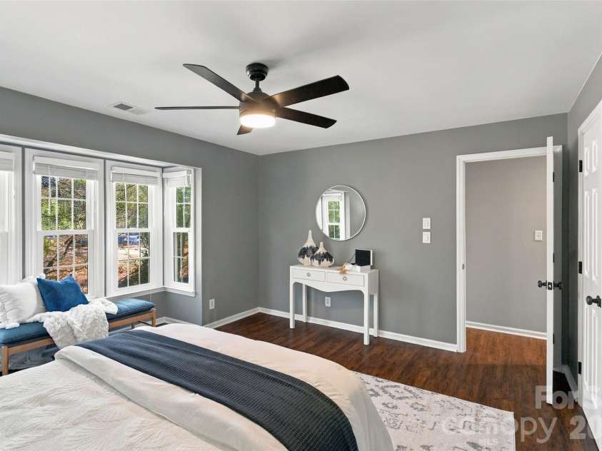 762 Marsh Road, Charlotte, NC 28209.  MLS# CAR4340120, YatesRealty ID 54407. Spacious primary bedroom with ceiling fan and abundant natural light